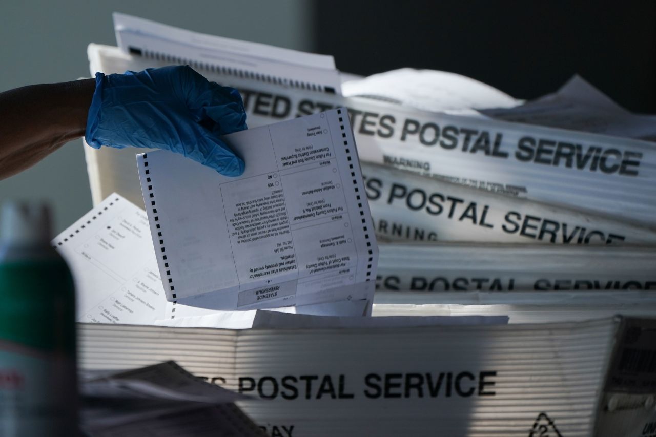 An election official counts absentee ballots in Atlanta on November 4.