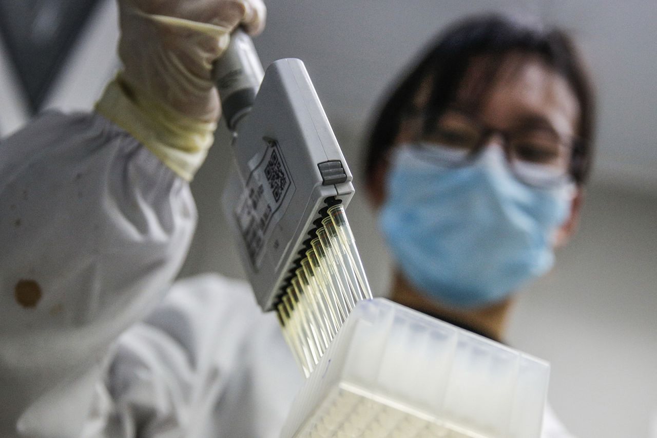 A staff member tests samples of the Covid-19 inactivated vaccine at a Sinovac Lab in Beijing on March 16. 