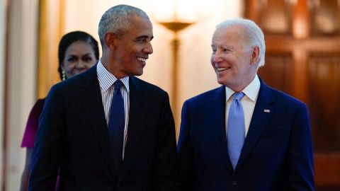 Former President Barack Obama and President Joe Biden arrive in the East Room of the White House on Wednesday.