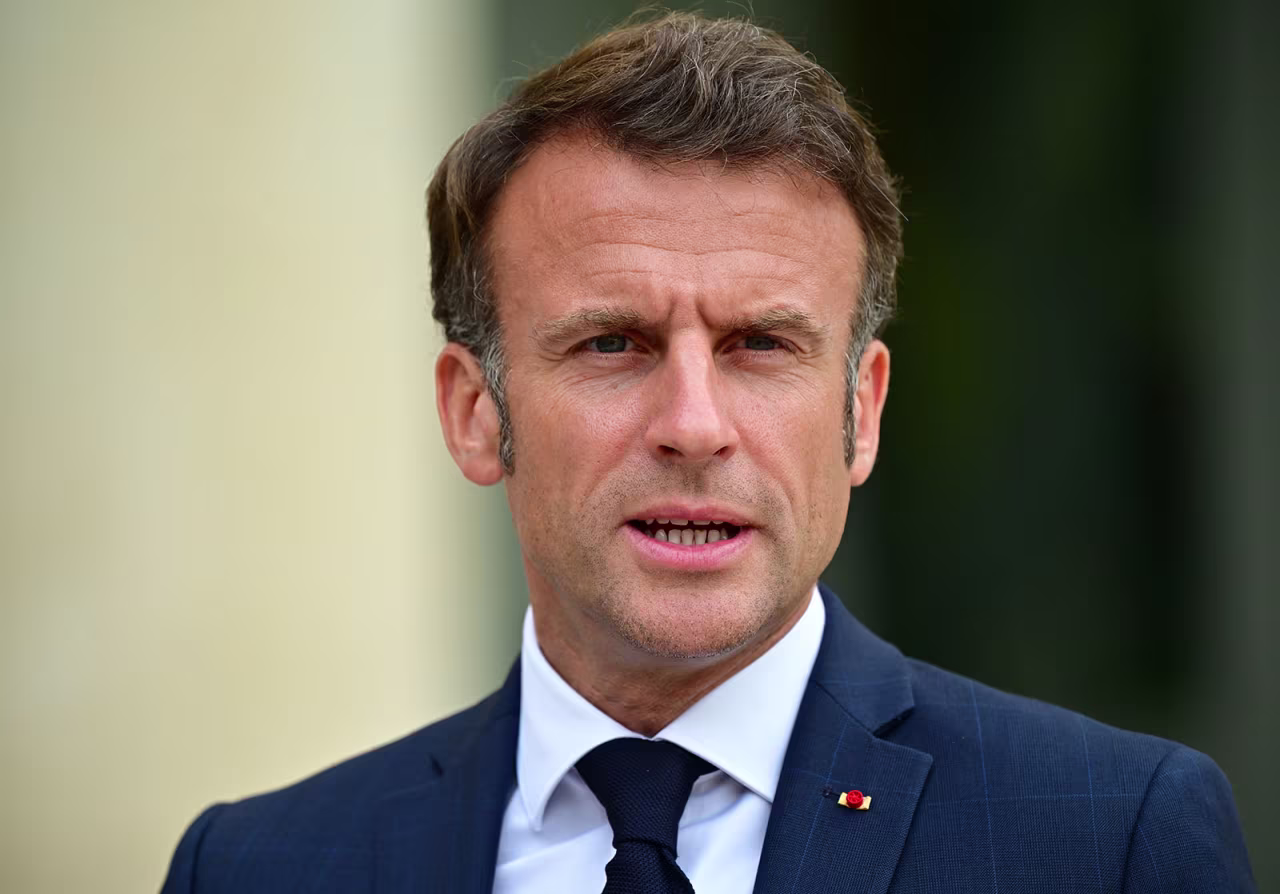 French President Emmanuel Macron addresses the press along with the secretary general of NATO ahead of their meeting at the Élysée Palace on June 28 in Paris.