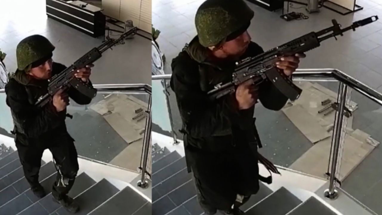 Surveillance camera footage obtained by CNN shows the suspect inside the dealership, which the group of Russian soldiers looted.