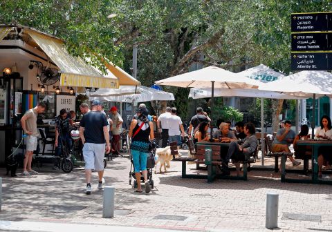 People sit outside a cafe in Israel's Mediterranean coastal city of Tel Aviv, Israel, on May 27.