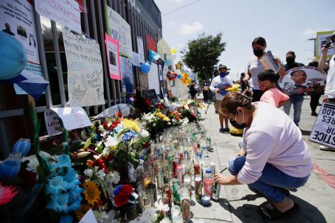 People leave candles and other items at a makeshift memorial for Andres Guardado on June 21 in Gardena, California.