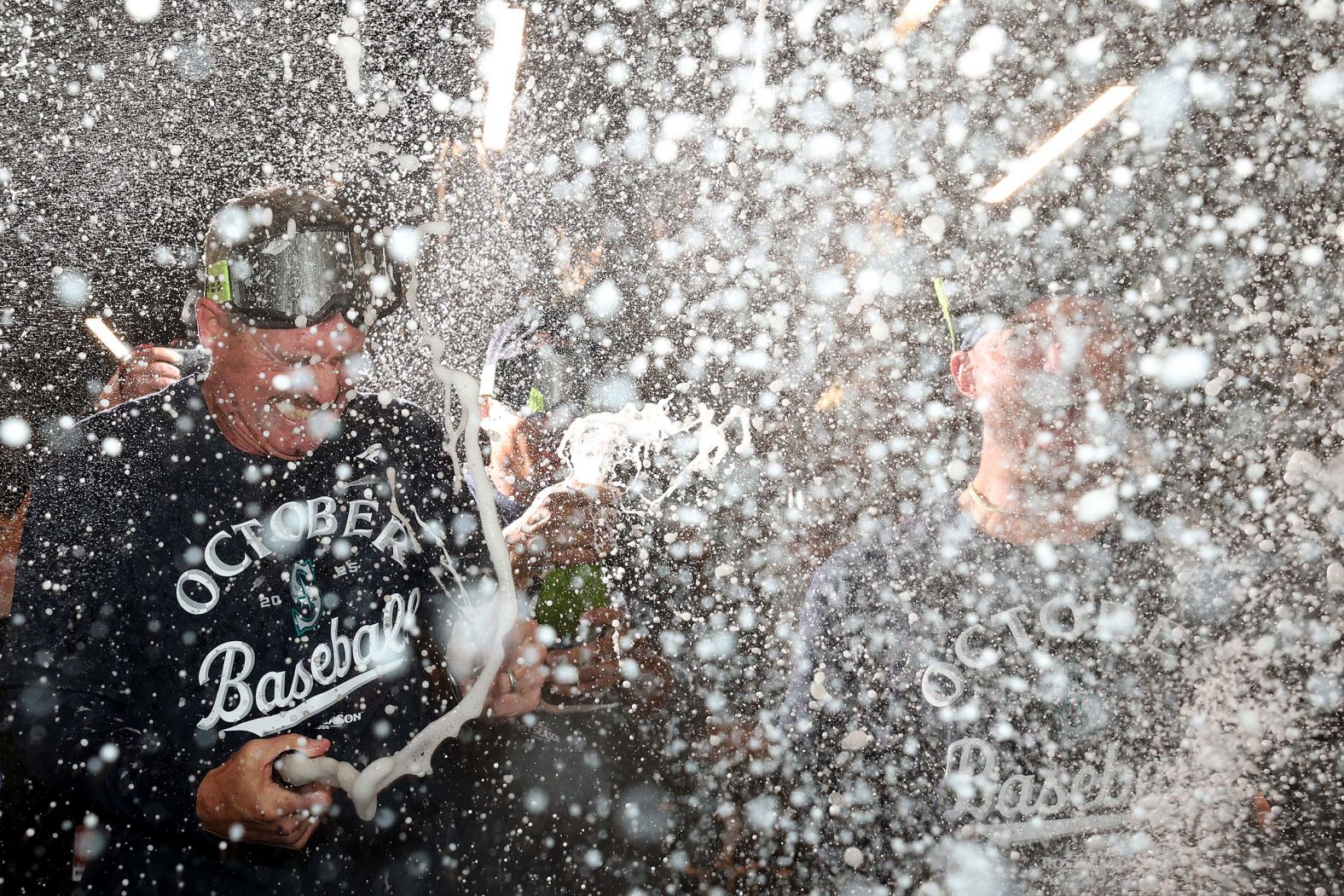 Seattle Mariners manager Dan Wilson celebrates with his team after they clinched a playoff berth on Tuesday, September 23.