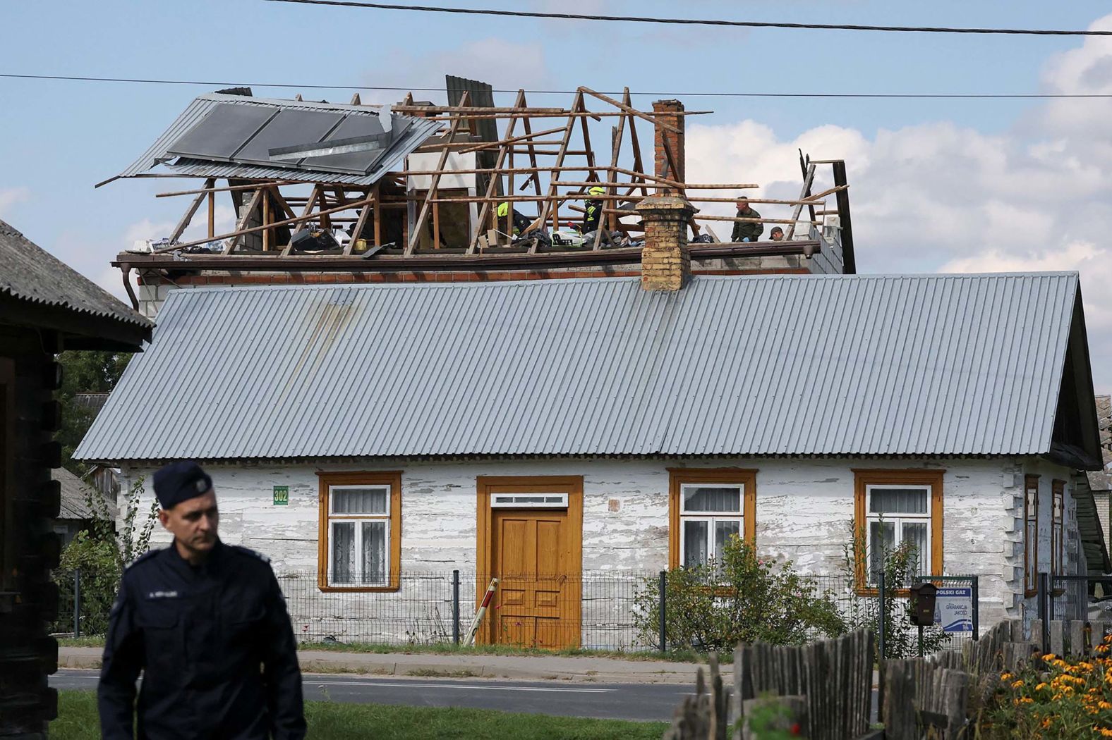 Firefighters work on the destroyed roof of a house in Wyryki, Poland, after <a href="index.php?page=&url=https%3A%2F%2Fwww.cnn.com%2F2025%2F09%2F09%2Feurope%2Fpoland-scramble-jets-russian-drone-reports-intl-hnk-ml">Russian drones violated Polish airspace</a> during an attack on neighboring Ukraine on Wednesday, September 10. NATO fighter jets shot down multiple Russian drones. It marked the first time that shots were fired by NATO since the start of the war in Ukraine.