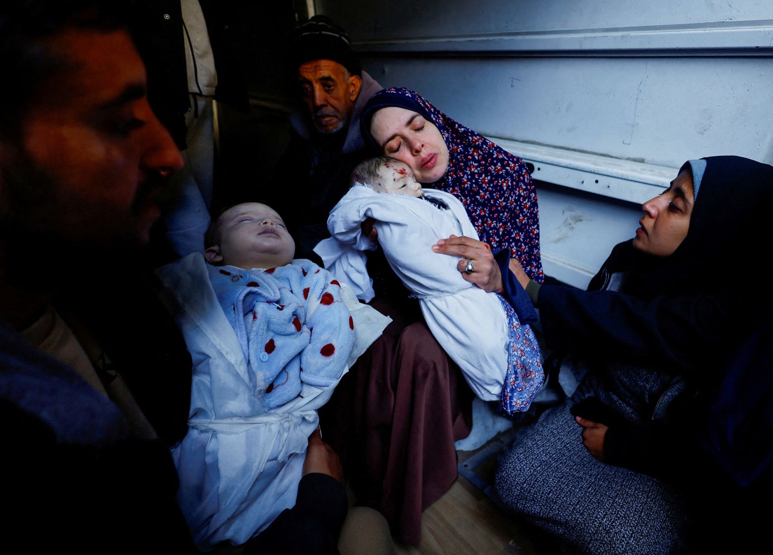 Rania Abu Anza holds one of her 5-month-old twins who were killed when an Israeli strike hit their house in Rafah, Gaza, on March 3. Abu Anza’s husband and at least 11 other relatives were killed when the house collapsed. “I screamed for my children and my husband,” she said, <a href="https://apnews.com/article/israel-hamas-war-children-twins-killed-gaza-25282b273b92aec7fc75c3212f8d8e3f" target="_blank">according to the Associated Press</a>. “They were all dead. Their father took them and left me behind.” It took Abu Anza and her husband 10 years and three rounds of in vitro fertilization to become pregnant.