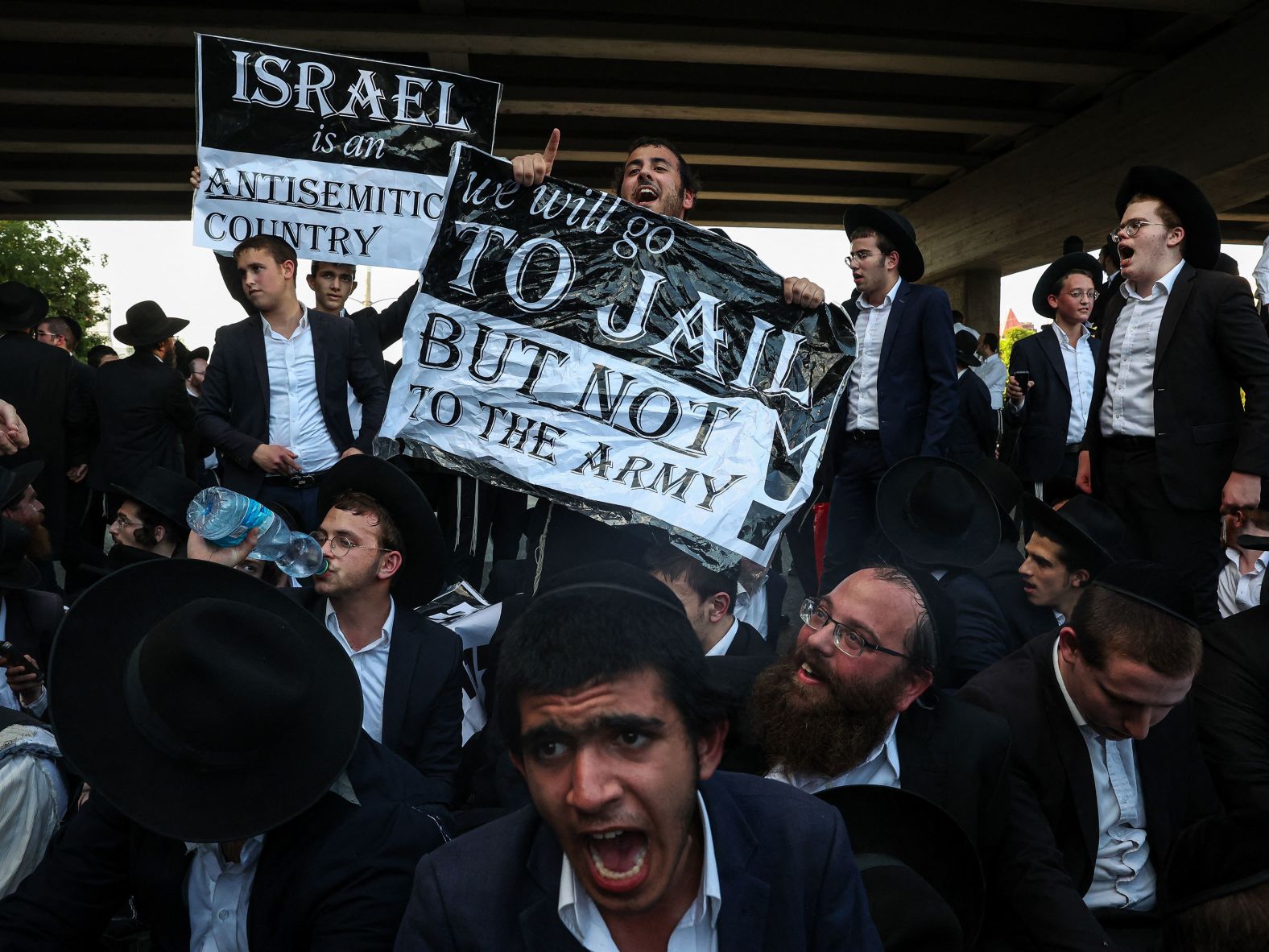 Ultra-Orthodox Jewish men protest in Bnei Brak, Israel, on Thursday, July 16. A Supreme Court ruling on June 25 said <a href="index.php?page=&url=https%3A%2F%2Fwww.cnn.com%2F2024%2F07%2F01%2Fmiddleeast%2Fultra-orthodox-in-israel-defy-orders-to-serve-in-military-mime-intl%2Findex.html">the Israeli government must enlist draft-age ultra-Orthodox Jews into the military</a>, reversing a de facto exemption in place since the country’s founding 76 years ago.