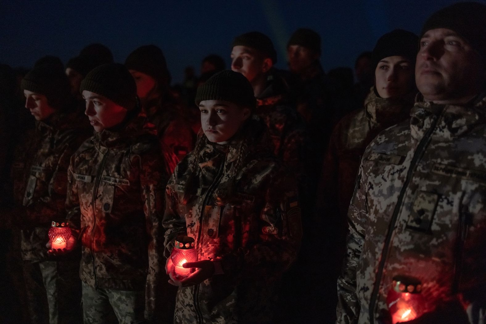 Ukrainian cadets and soldiers hold candles as they attend a ceremony in Kyiv, Ukraine, marking the 1,000th day of Russia’s invasion on Tuesday, November 19.