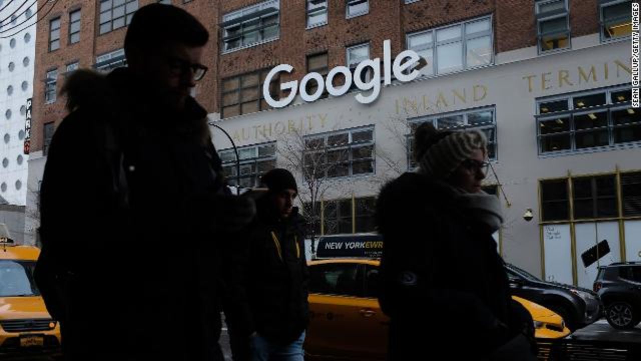 People walk past a Google office building on 9th Avenue in Chelsea district on December 30, 2017 in New York City. 