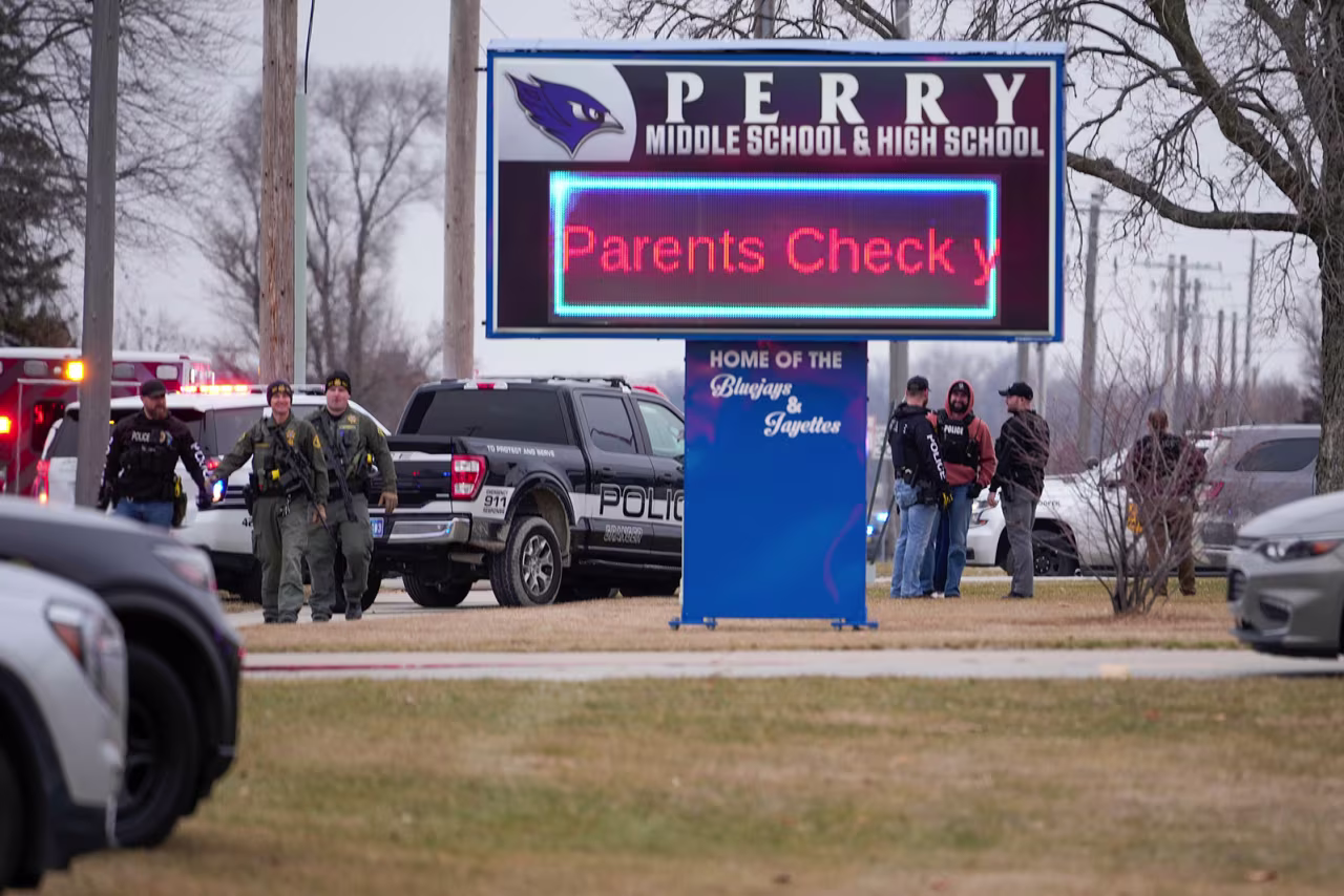 Police respond to Perry High School in Perry, Iowa, on Thursday.