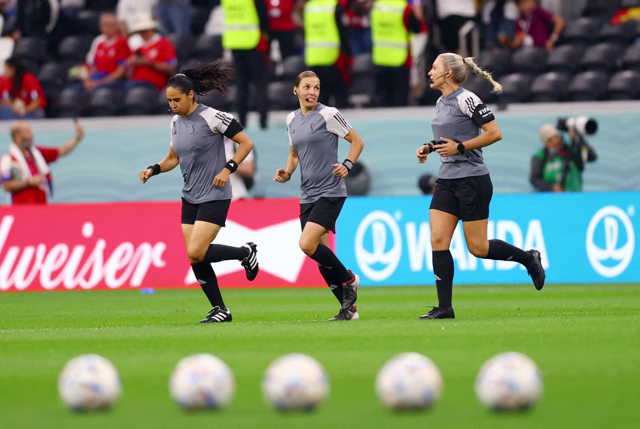 Referee Stéphanie Frappart warms up alongside assistant referees Neuza Back and Karen Diaz Medina before the match between Costa Rica and Germany in Al Bayt Stadium in Al Khor, Qatar on December 1.