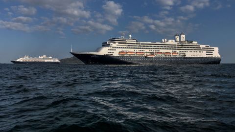 Holland America cruise ships — the Zaandam, left, and the Rotterdam — are seen in Panama City bay on Saturday, March 28.