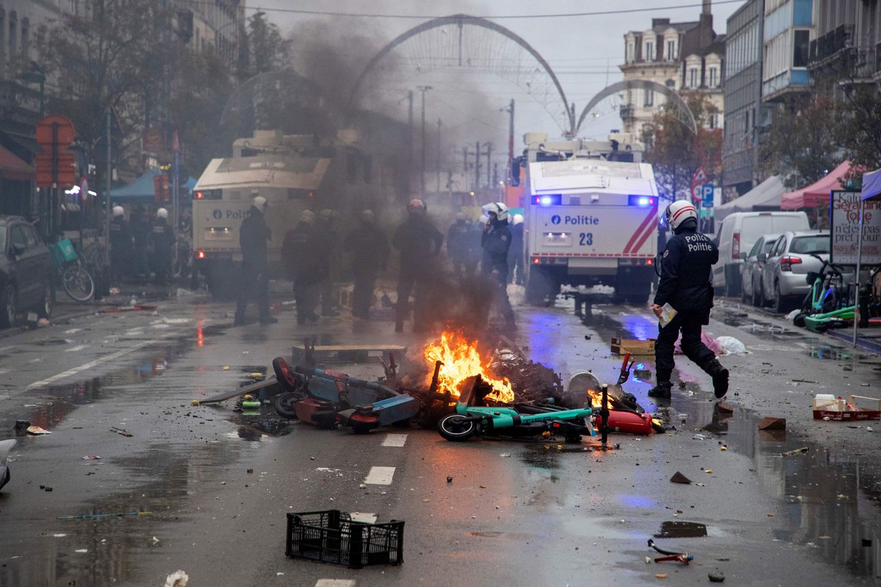 Riot police working to clear the street during clashes with supporters on the sideline of the live broadcast of the World Cup match between Belgium and Morocco, in Brussels on November 27.