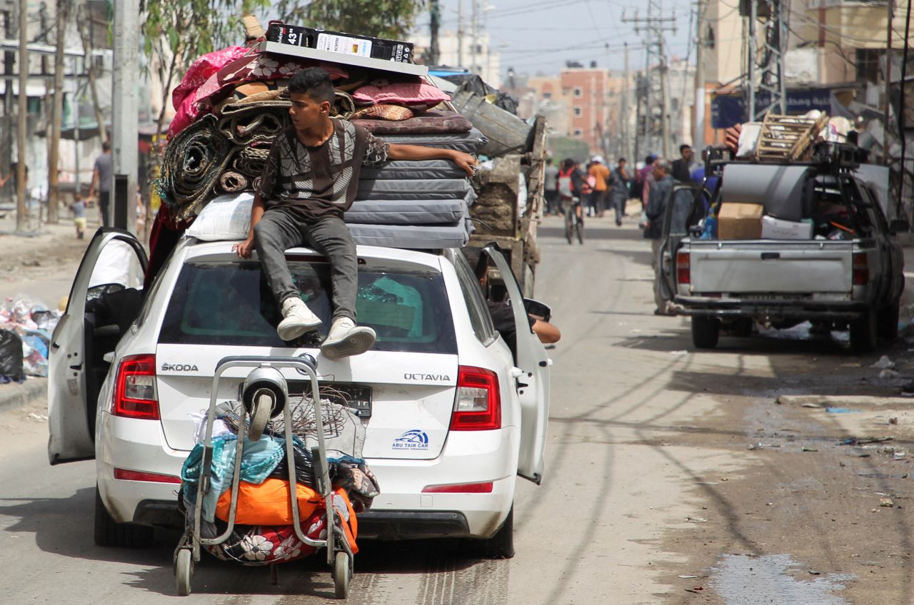 Palestinians load their car with belongings to evacuate Rafah, Gaza, on May 11. 