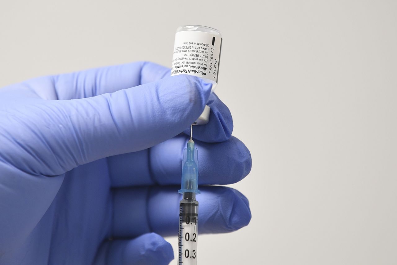 A dose of the Pfizer-BioNTech Covid-19 vaccine is prepared at a vaccination health center on December 8 in Cardiff, England. 