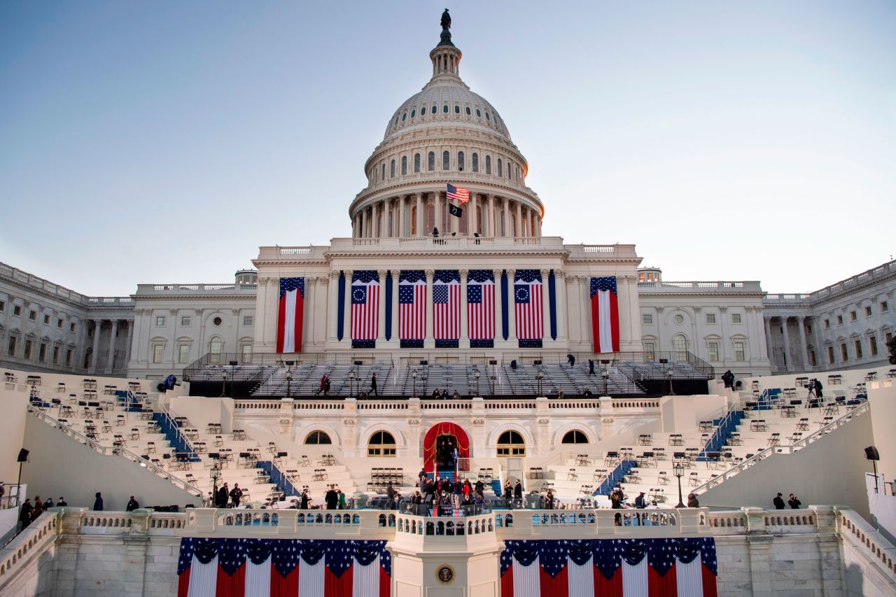 The sun rises as preparations are made at the Capitol on January 20.