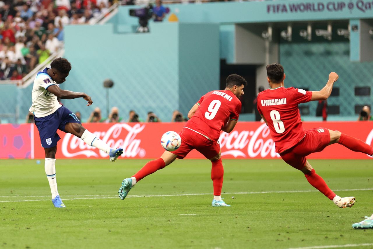 Arsenal winger Bukayo Saka powers in the second for England off a half-volley . 