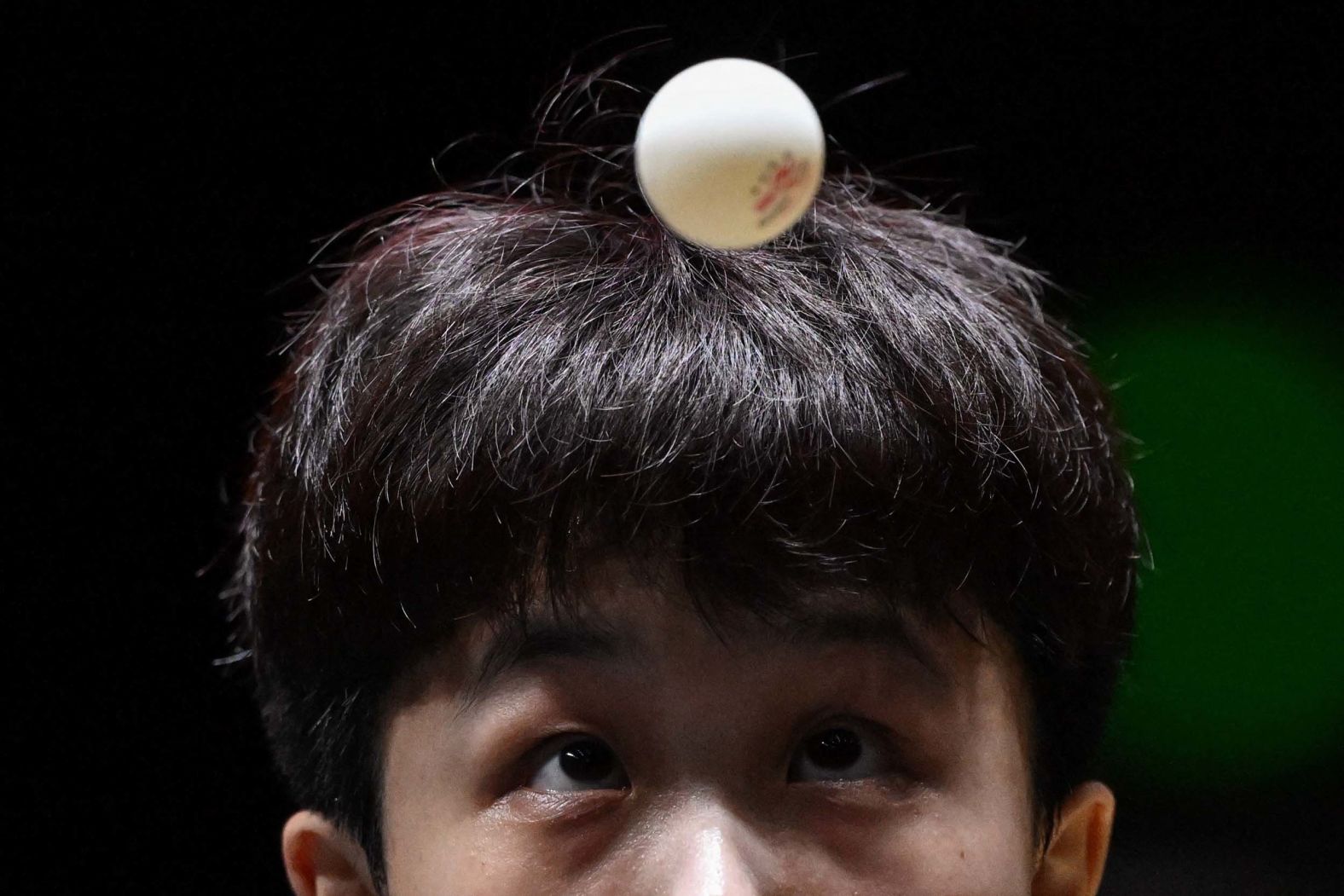 South Korean table tennis player Joo Cheon-hui serves during a quarterfinal match at the China Smash tournament in Beijing on Friday, October 3.