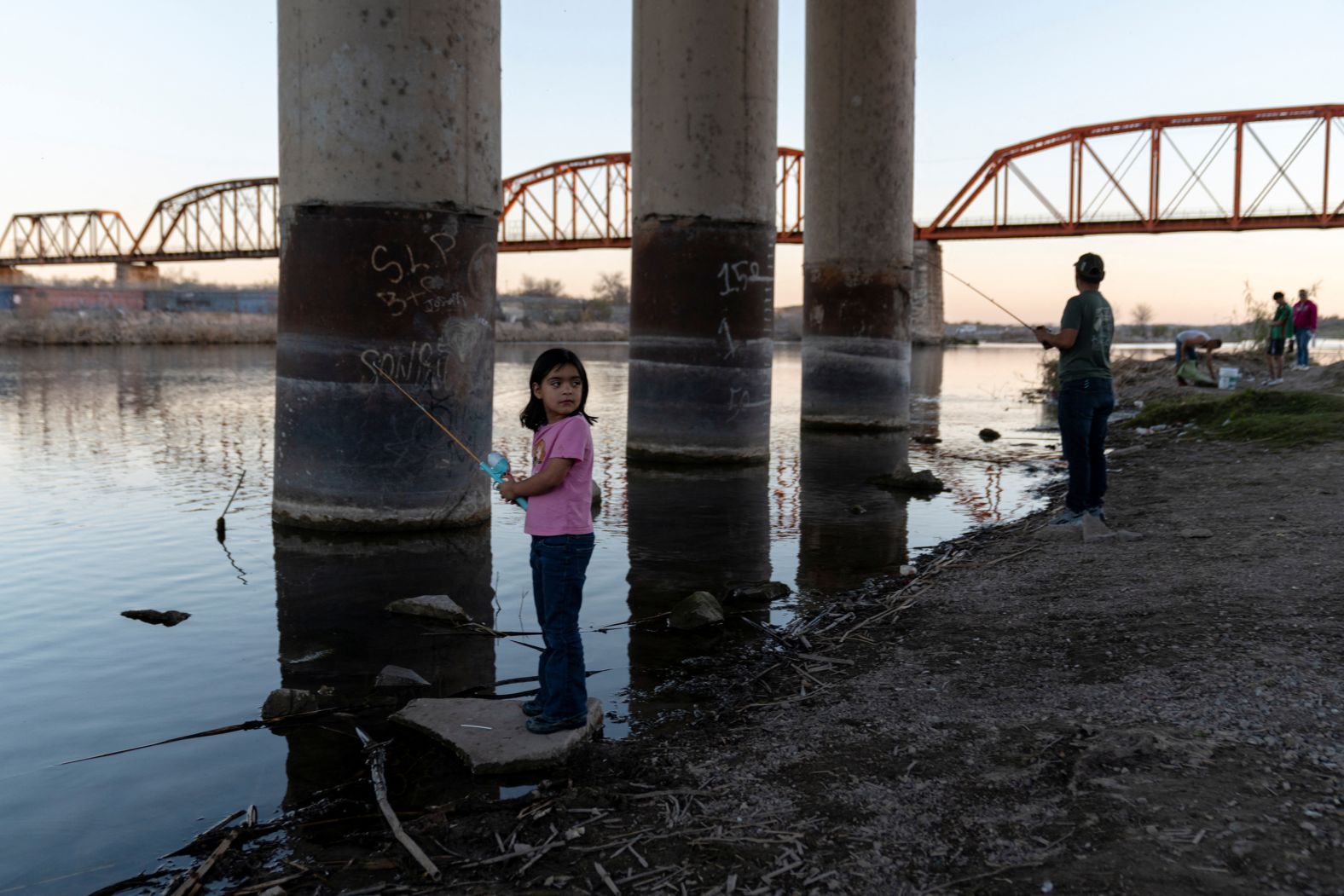 A girl fishes in the Rio Grande in Piedras Negras, Mexico, on Saturday, January 18.
