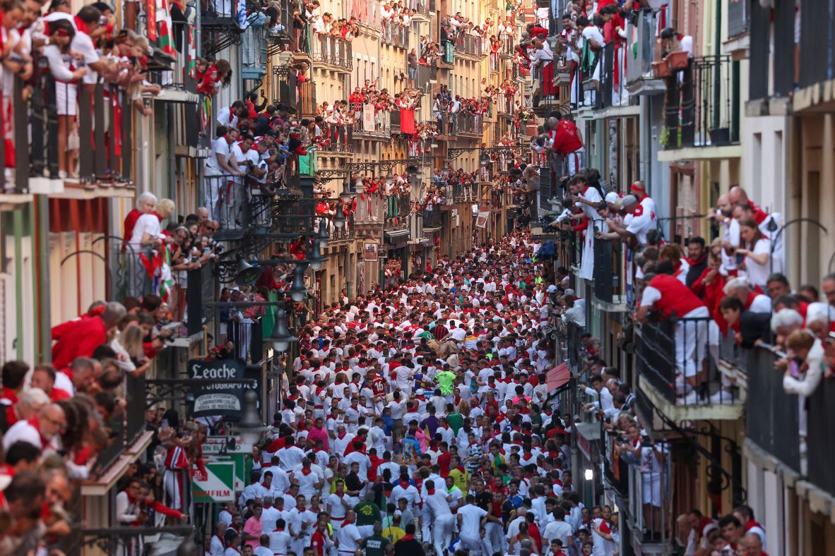Revelers pack Calle Estafeta during the annual Running of the Bulls in Pamplona, Spain, on Wednesday, July 9.