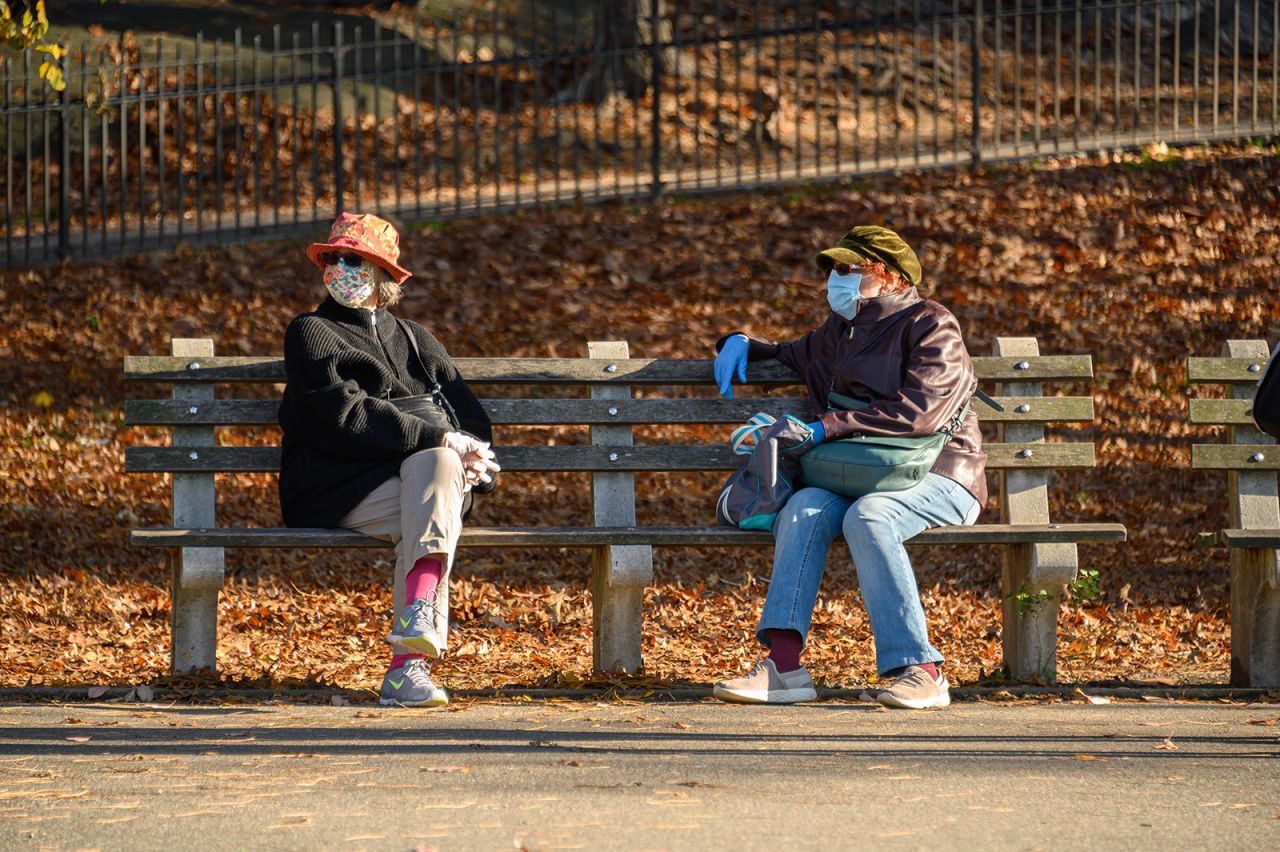 People wear face masks and rubber gloves in Riverside Park on November 14 in New York.