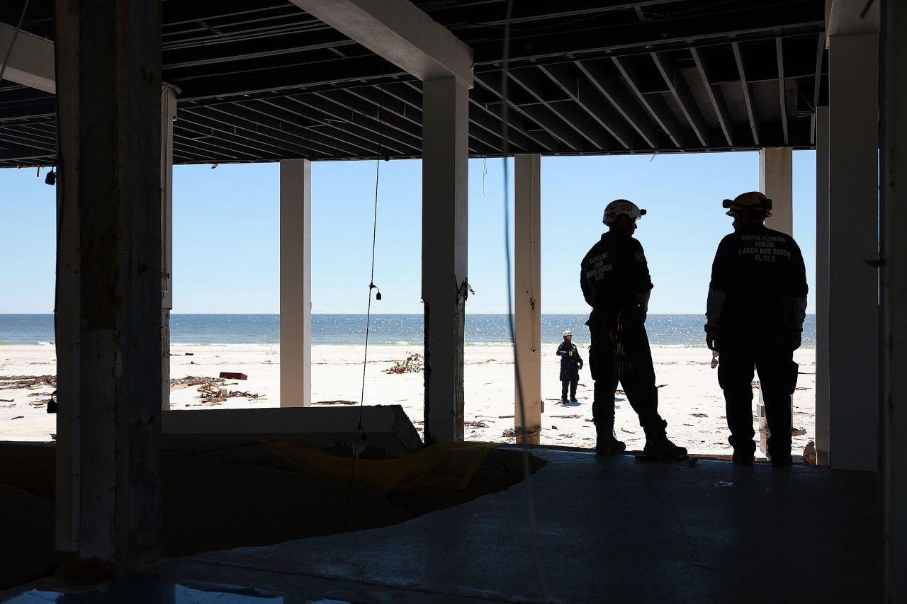 Members of the City of Miami Florida Task Force 2 Search and Rescue team check a home for victims in Fort Myers Beach, Florida, on Monday.