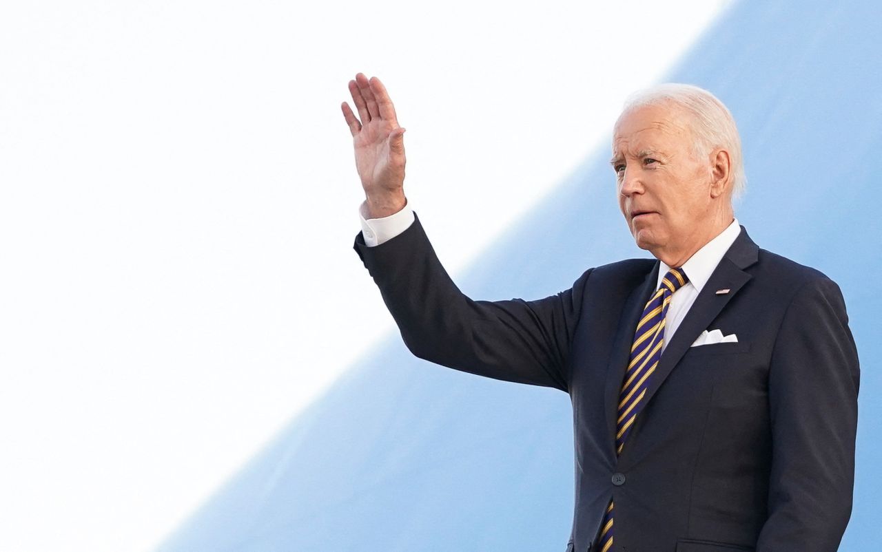 US President Joe?Biden?waves upon arrival in Helsinki,?Finland, on July 12, 2023.