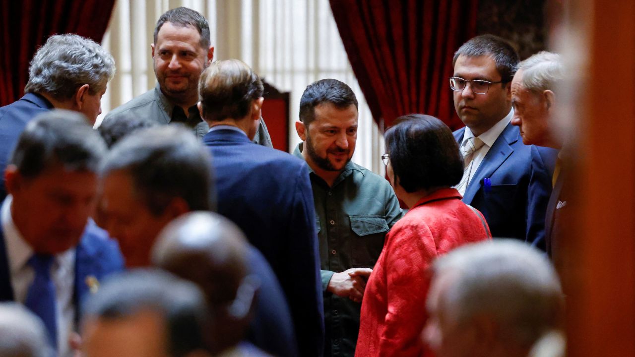 Ukrainian President Volodymyr Zelensky speaks with U.S. Senators John Kennedy, Ron Wyden, Maisie Hirono and Tom Carper after a meeting with all members of the Senate held in the Old Senate Chamber, during a visit to the Capitol in Washington, DC, on Thursday.