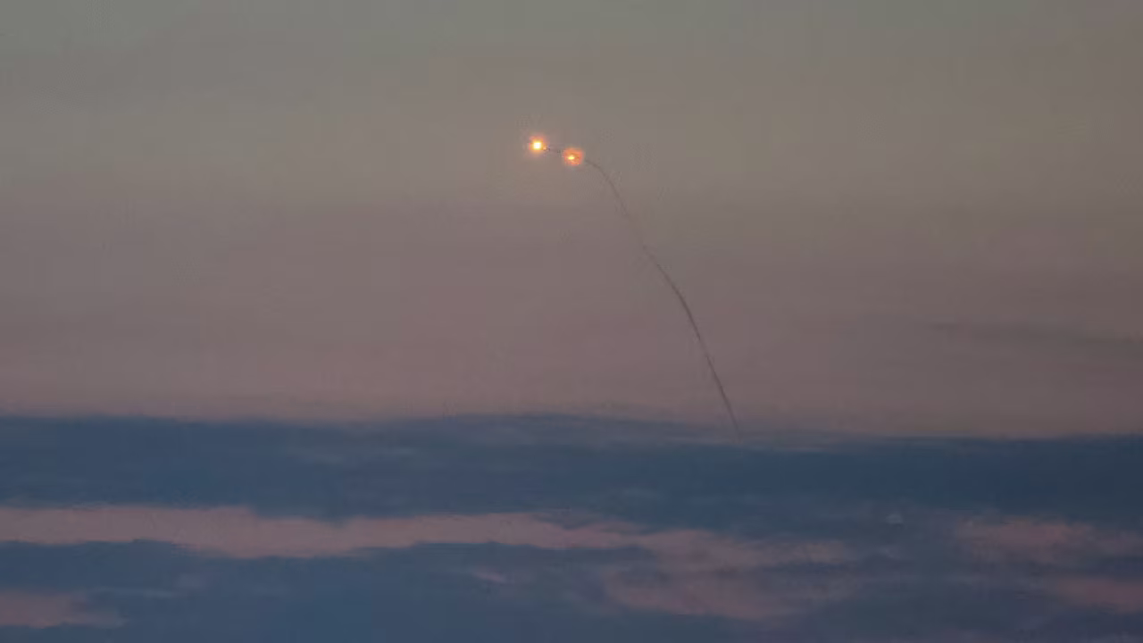 An explosion of a drone is seen over Kyiv on Tuesday.