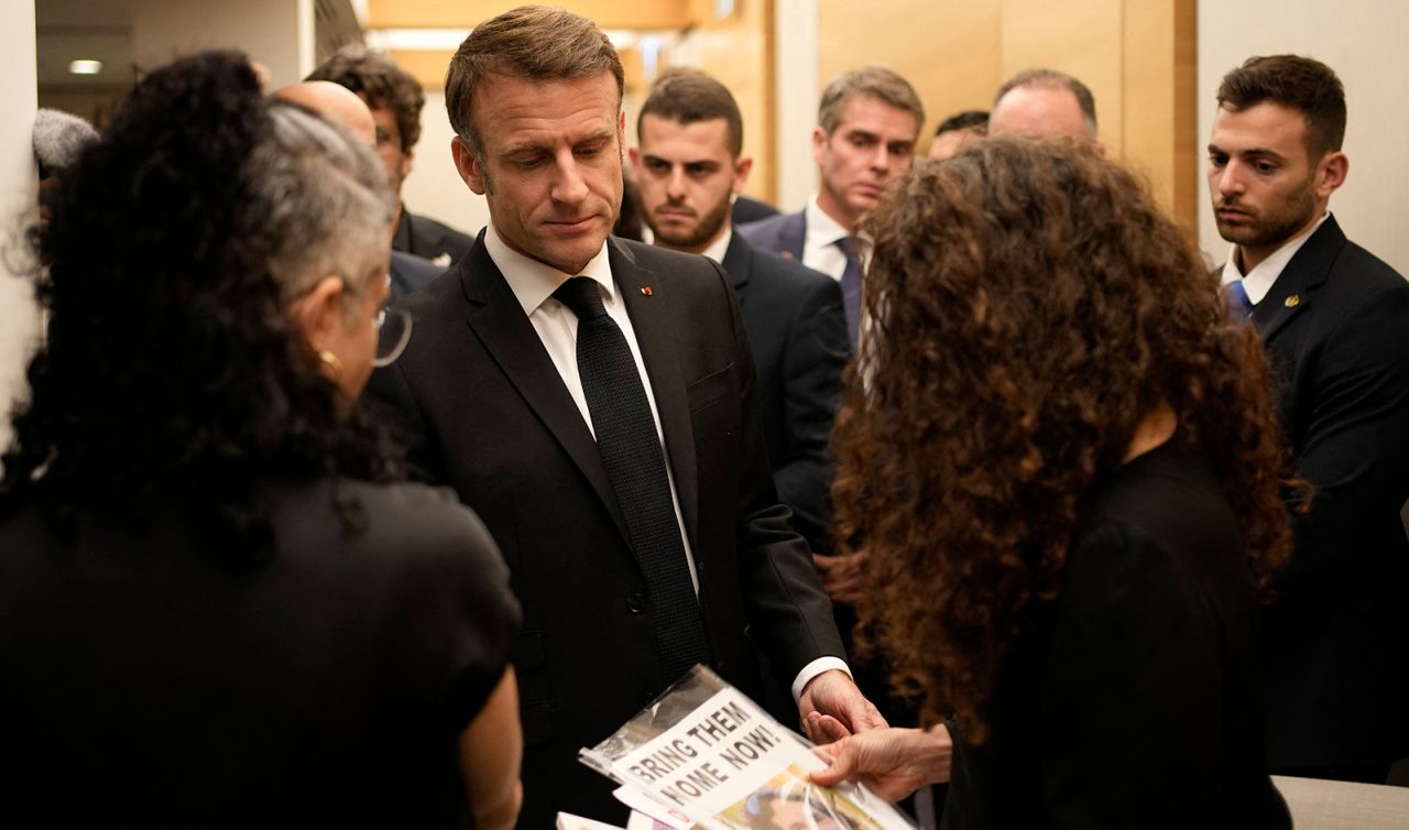 Emmanuel Macron meets with Israeli-French nationals who have lost loved ones, as well as families of hostages, at Ben Gurion airport in Tel Aviv on October 24.