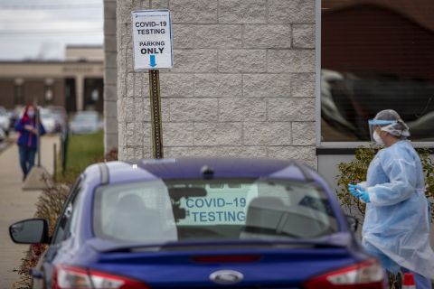 In this November 13 file photo, a nurse works at the Hackley Community Care Covid-19 curbside testing site in Muskegon Heights, Michigan.