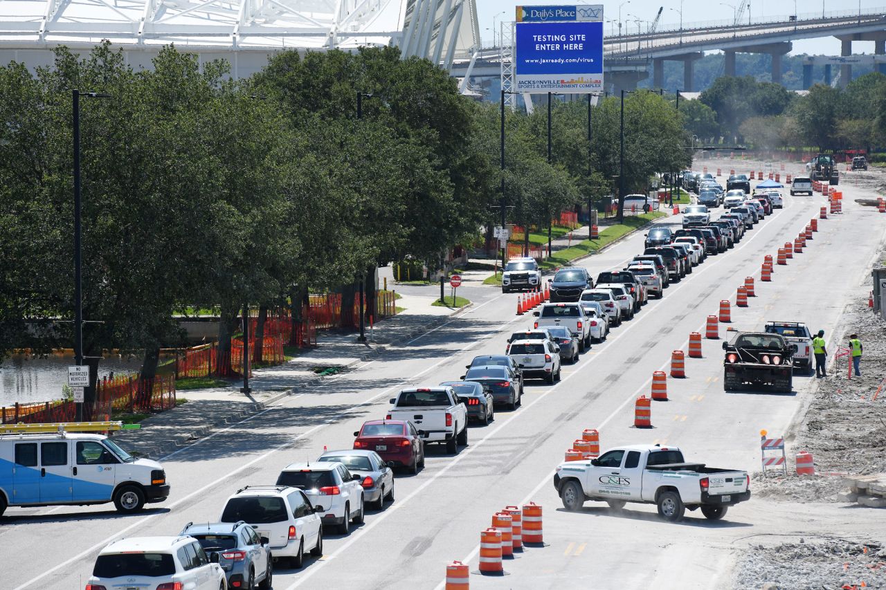 People line up in their cars at a coronavirus testing site outside TIAA Bank Field in Jacksonville, Florida, on June 18.