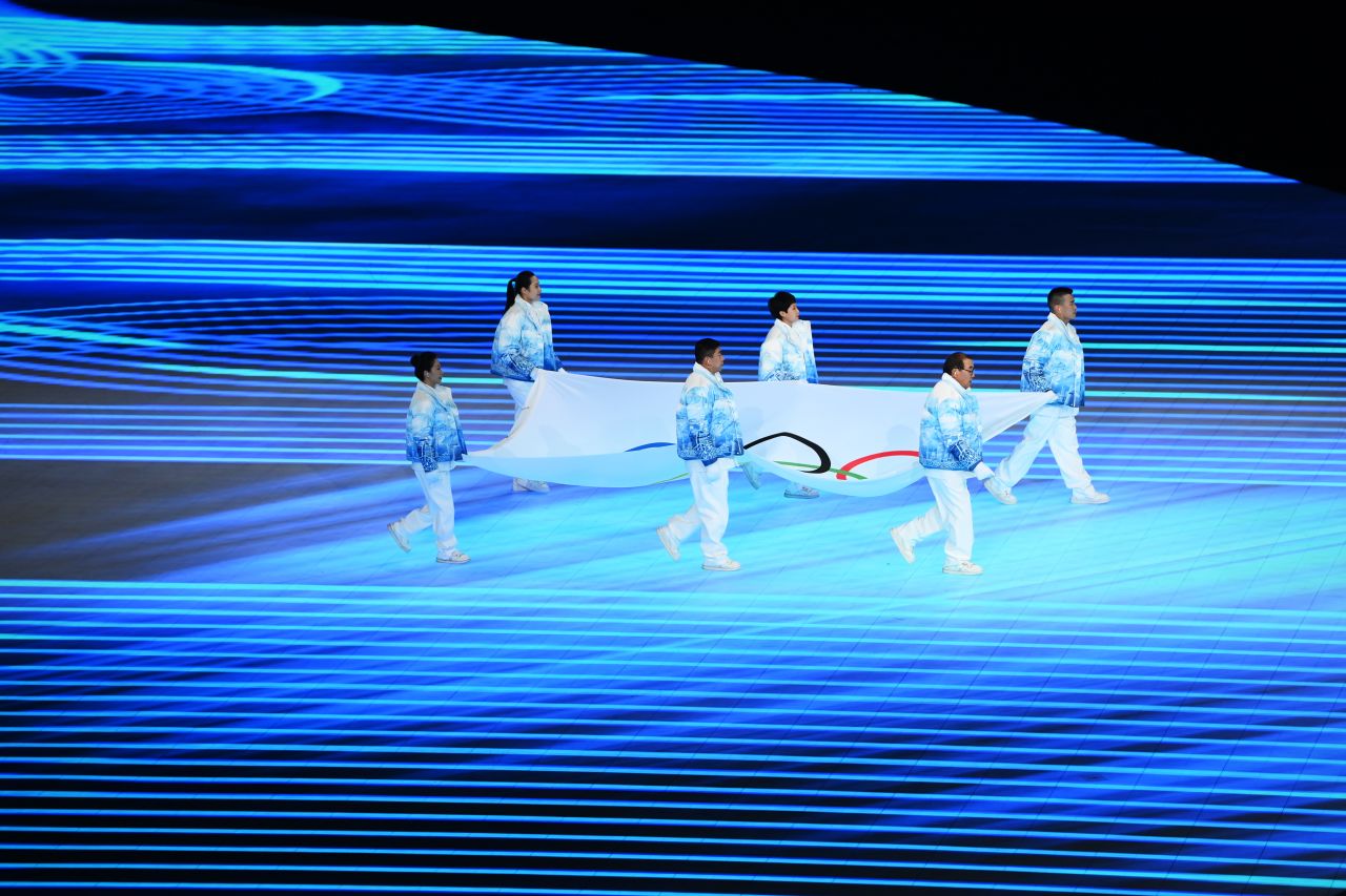 Performers carry the Olympic flag during the Opening Ceremony of the Beijing 2022 Winter Olympics at the Beijing National Stadium on February 04 in Beijing, China.