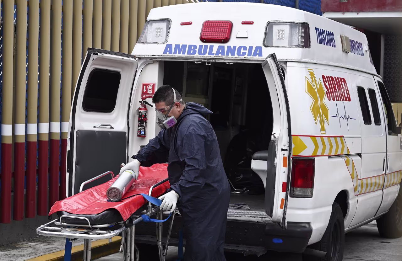 A paramedic prepares to move a patient suspected of having the novel coronavirus, at the Covid-19 triage area of the General Hospital in Mexico City on August, 20. 