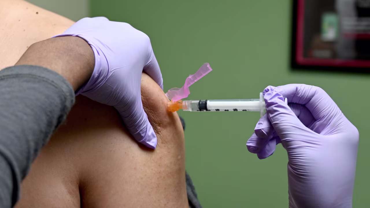 A man gets a flu shot at a health facility in Washington, DC, in January.