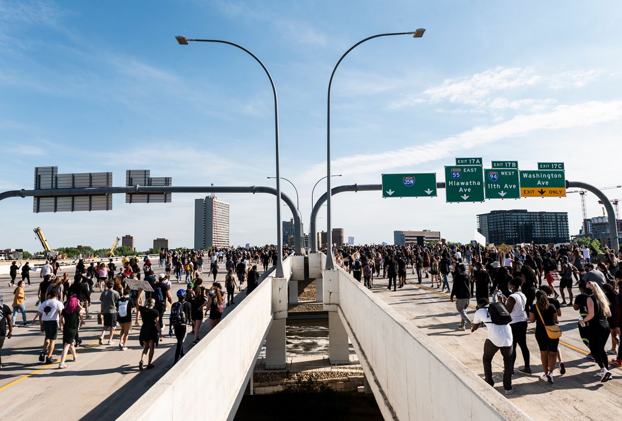 A crowd marches to protest the death of George Floyd on the I-35W bridge over the Mississippi River on May 31, in Minneapolis.