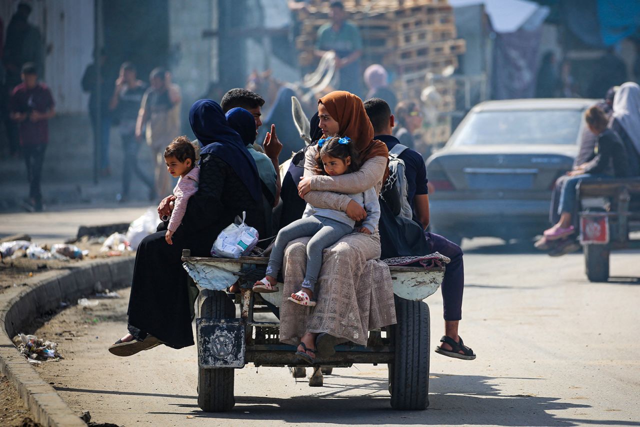 Displaced Palestinians travel on a cart in Rafah, southern Gaza Strip, on May 7.