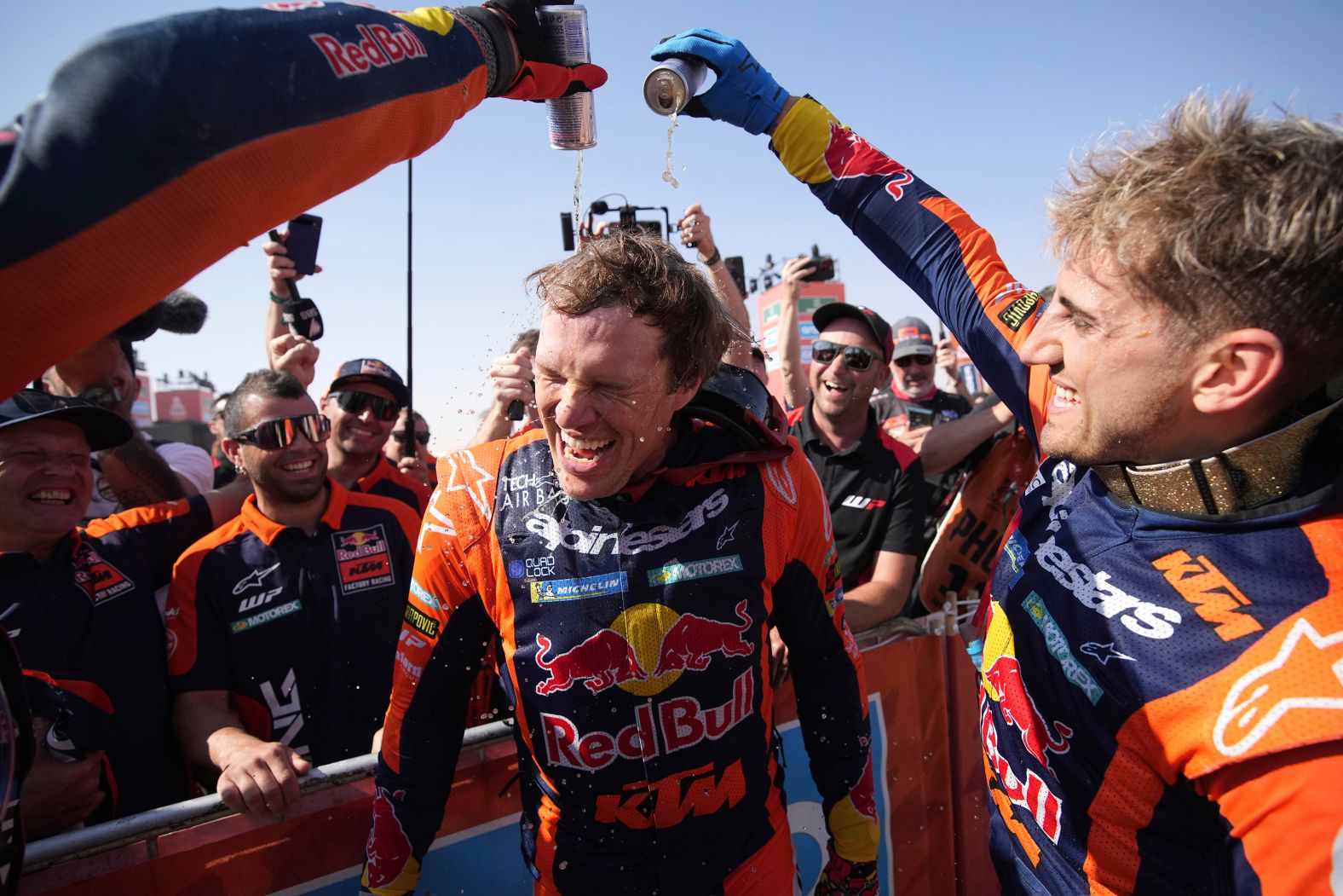 Motorcycle rider Daniel Sanders is doused with Red Bull after winning the Dakar Rally in Saudi Arabia on Friday, January 17.