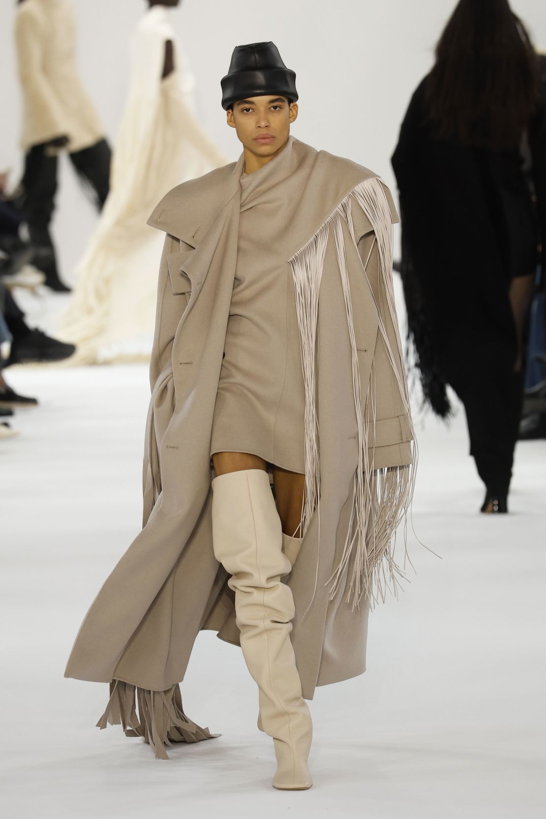 Sportmax took a bohemian-inspired approach with thigh-high boots and fringed outerwear.