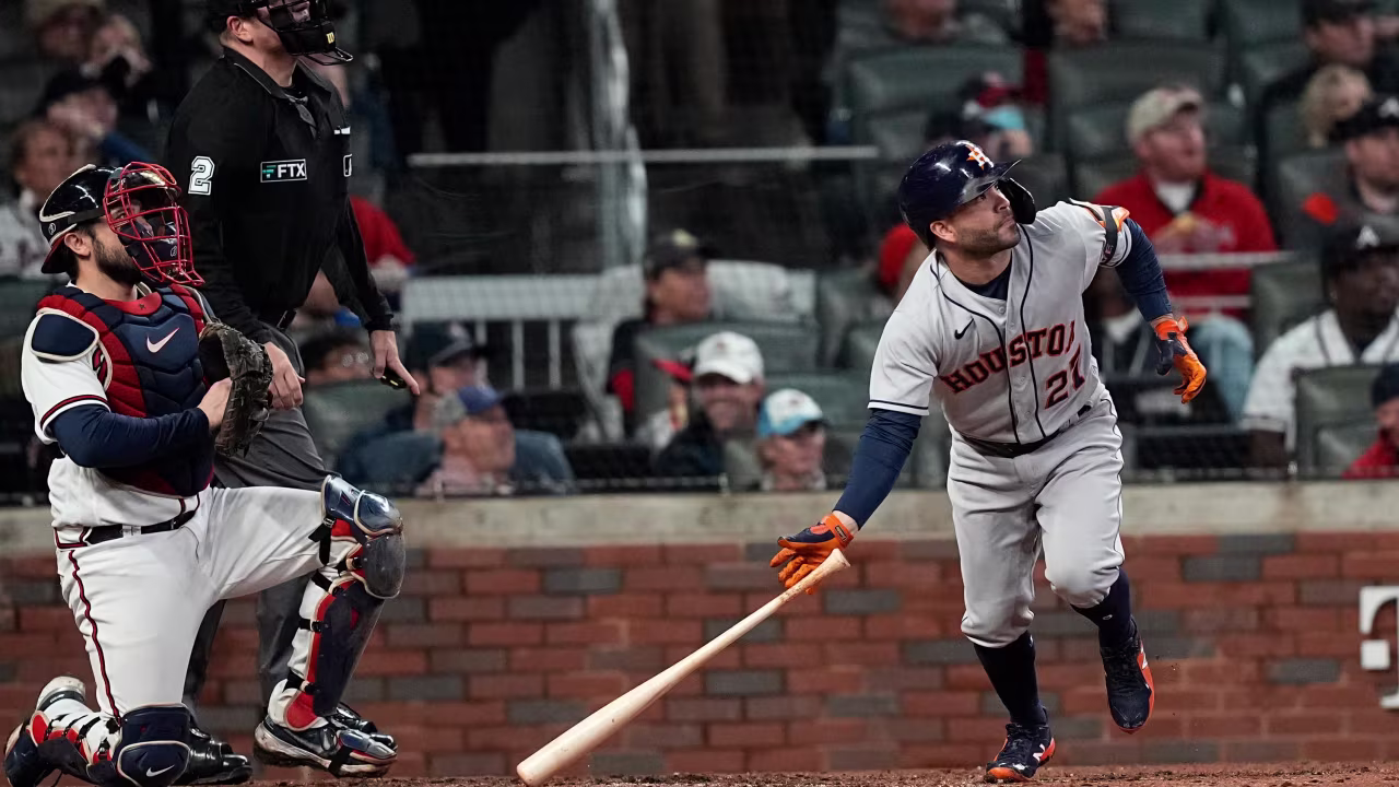 Astros' Jose Altuve watches his home run during the fourth inning.