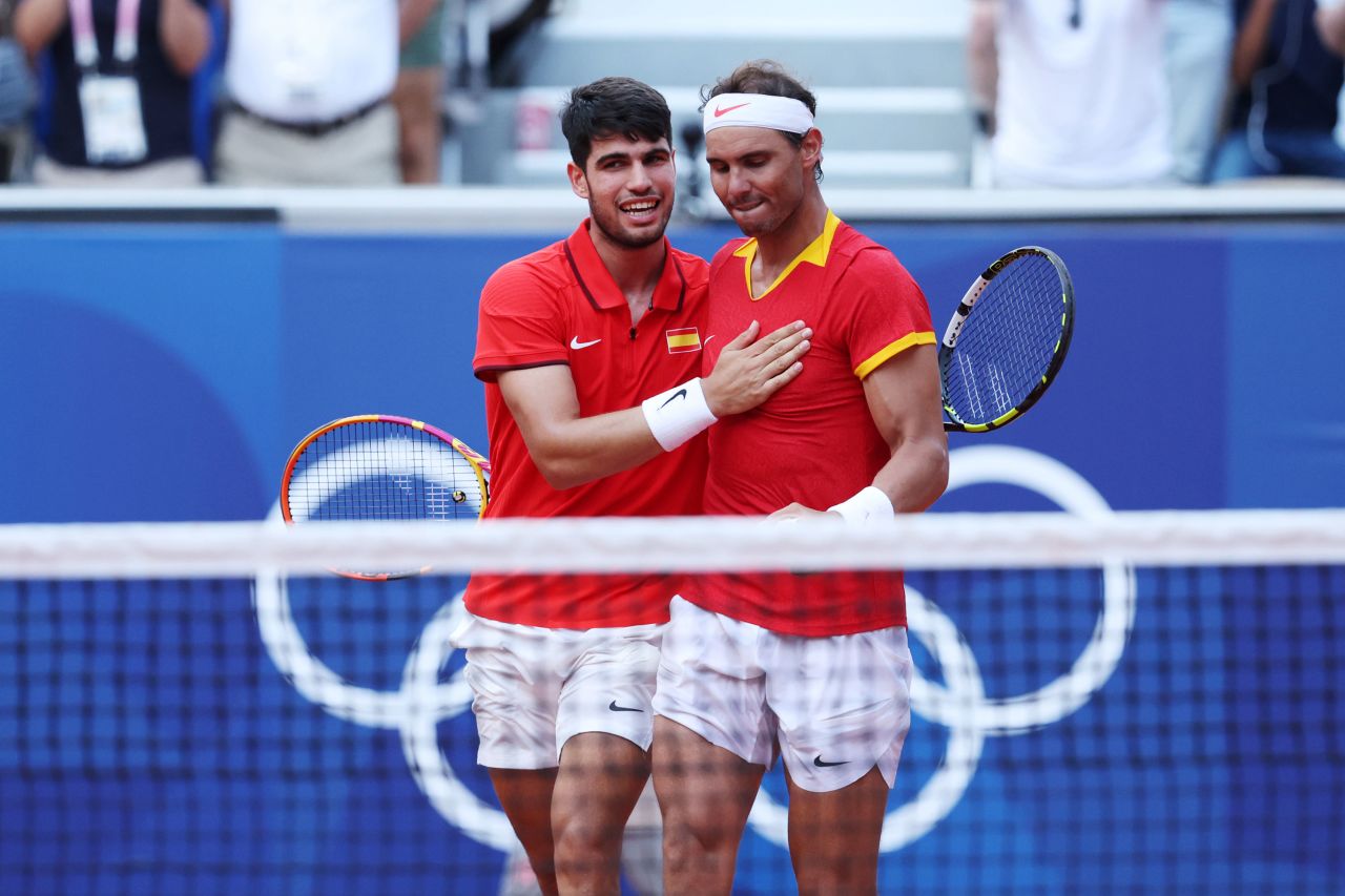 Carlos Alcaraz celebrates with partner Rafael Nadal after winning their men’s doubles quarterfinals match on Tuesday.