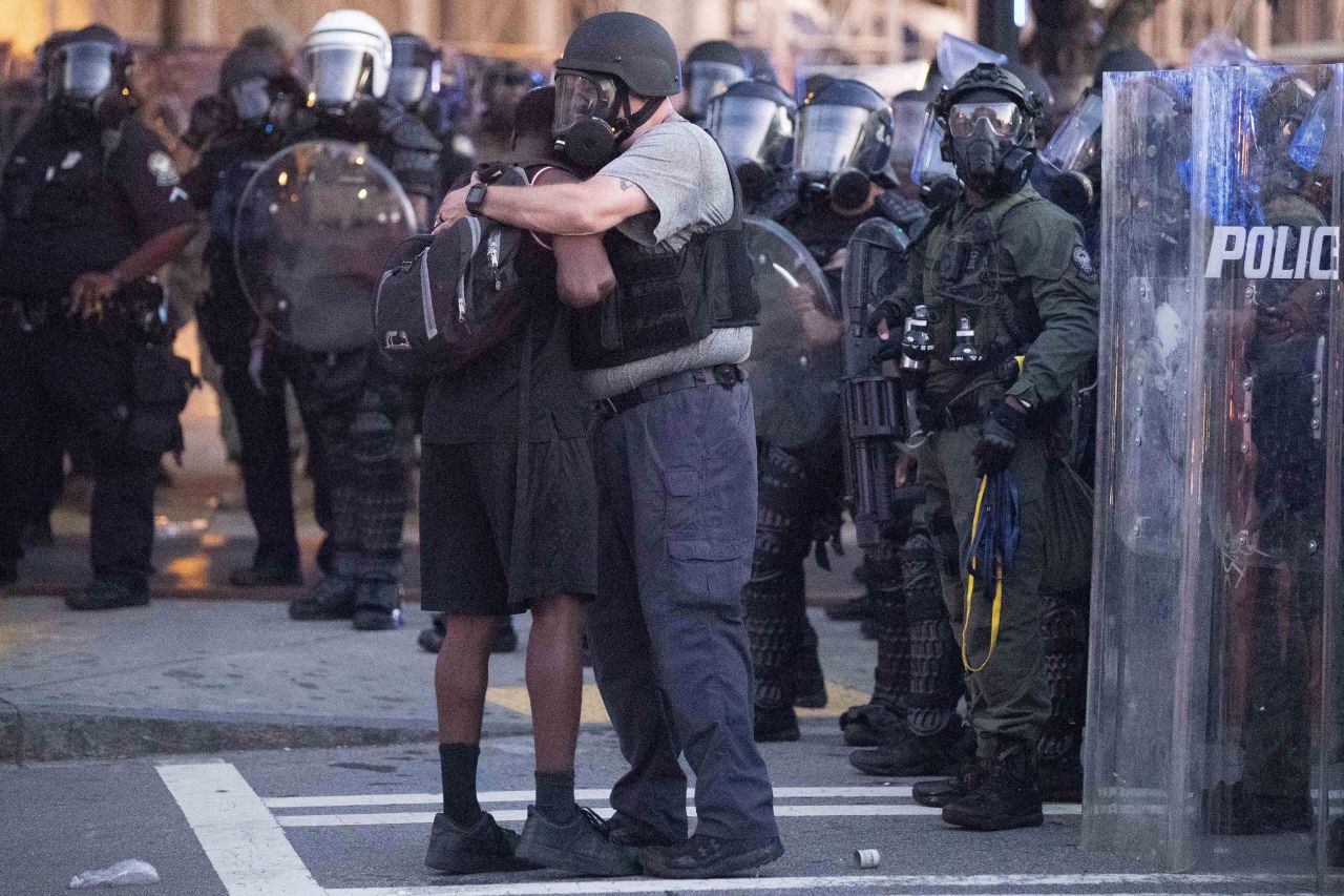 A police officer embraces a protester in Atlanta on June 1.