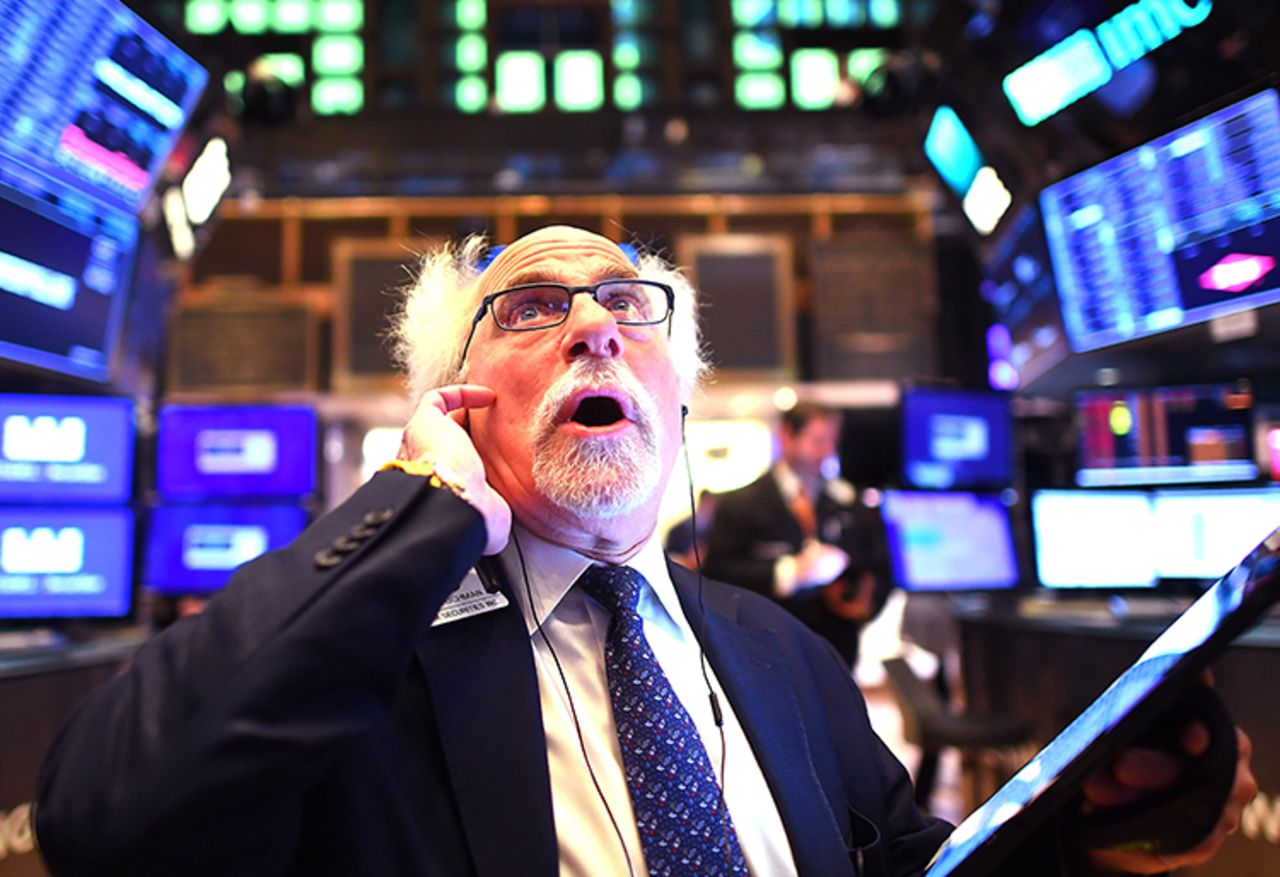 Traders work during the opening bell at the New York Stock Exchange (NYSE) on March 5 at Wall Street in New York City.