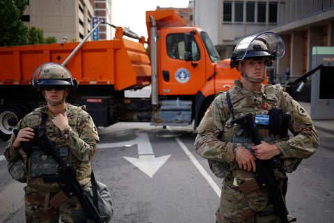 Kentucky Army National Guard soldiers stand guard during a protest in Louisville, Kentucky, on Thursday, September 24. 