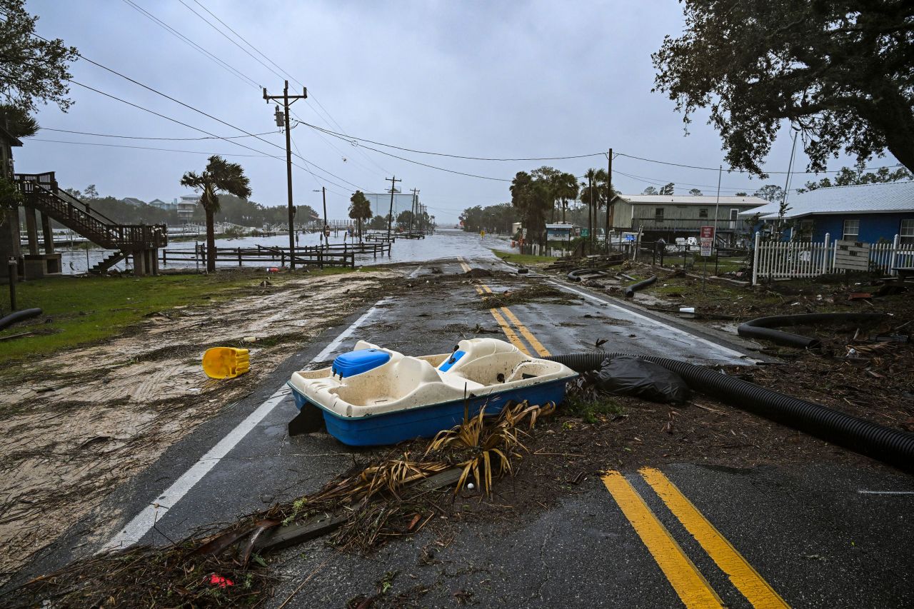 Debris is strewn across a flooded street near the Steinhatchee Marina.