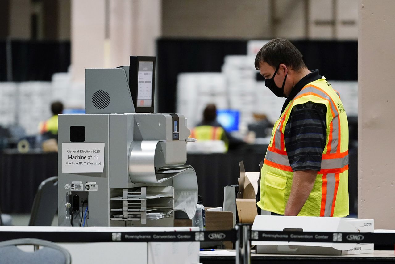 A Philadelphia election worker scans ballots for the 2020 general election in the United States at the Pennsylvania Convention Center, on Tuesday in Philadelphia. 