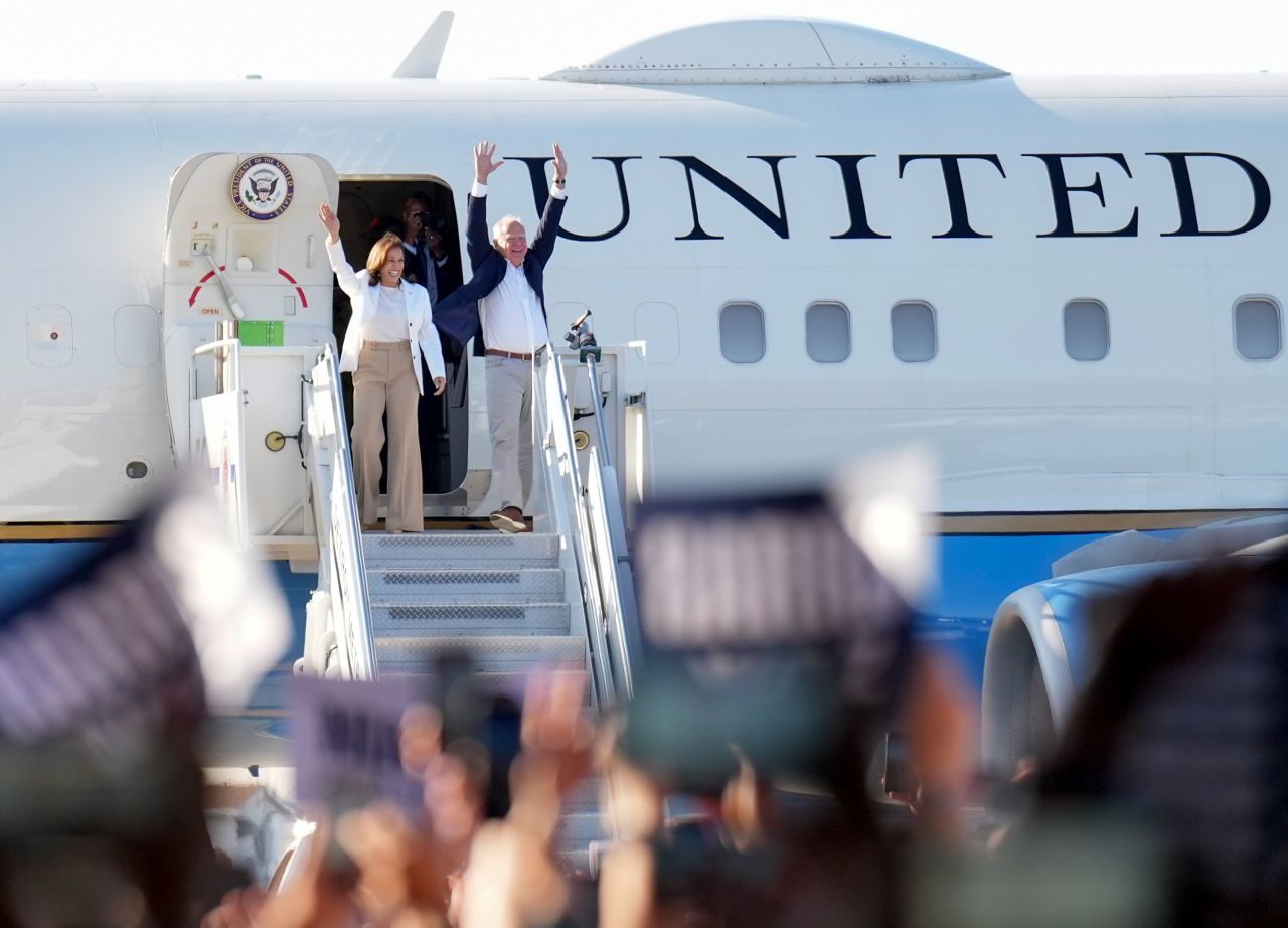 Vice President Kamala Harris and Minnesota Gov. Tim Walz arrive at the Detroit Metropolitan Wayne County Airport for a campaign rally on August 7.