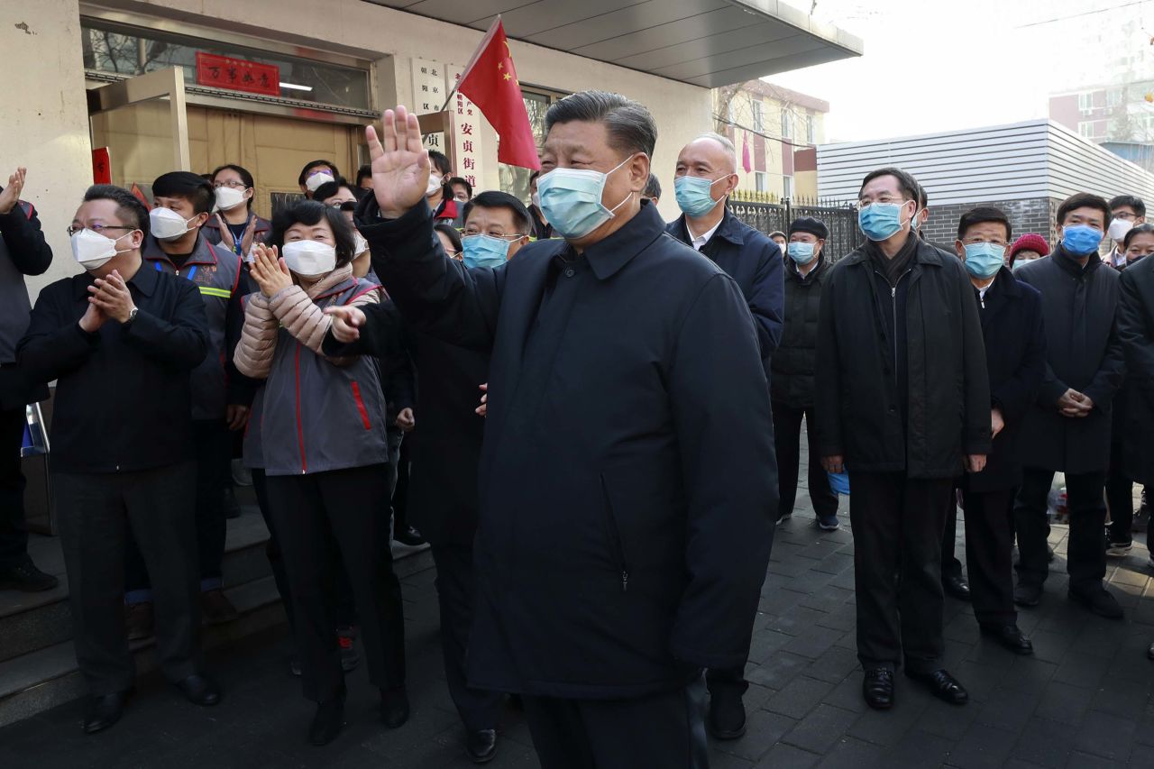 Chinese President Xi Jinping visits a coronavirus prevention site in Beijing on February 10 -- his first public appearance during the outbreak.