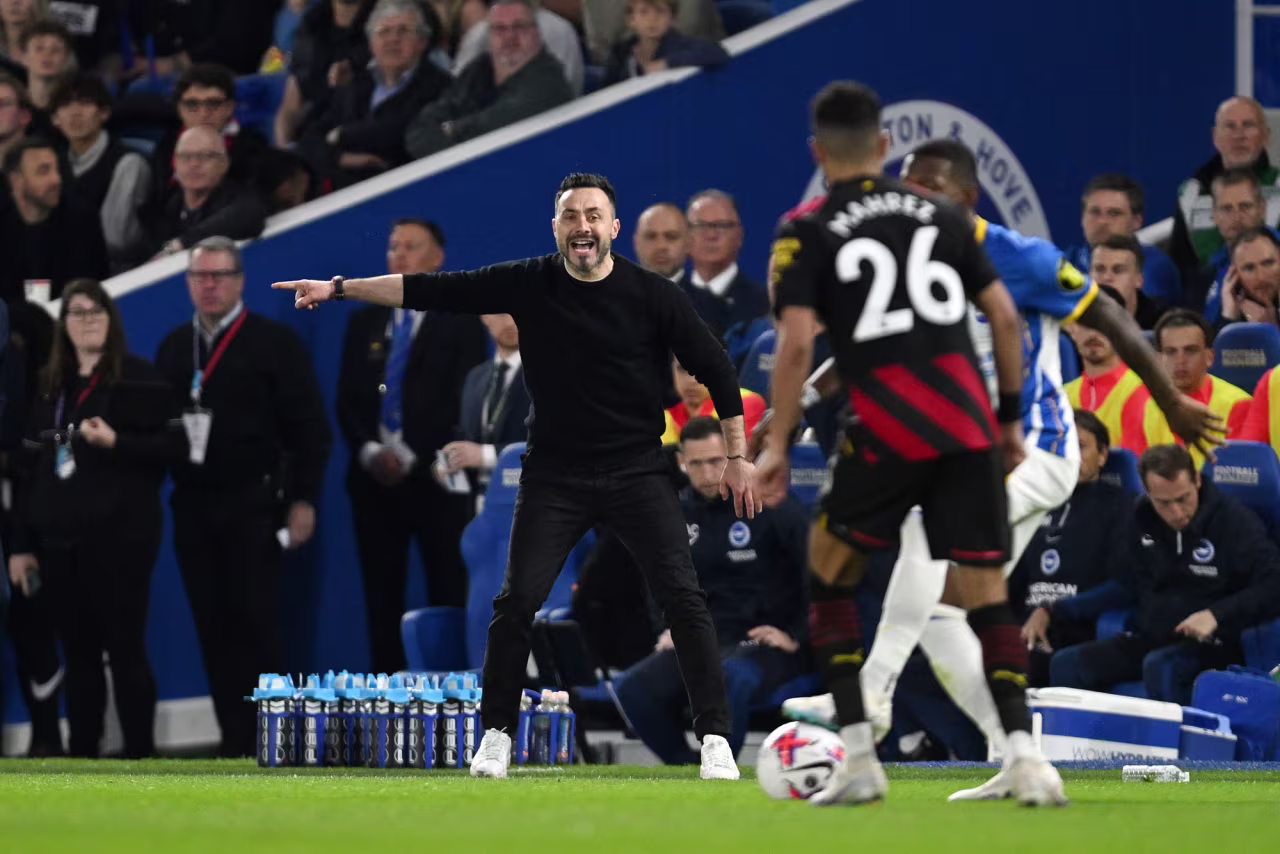 Roberto De Zerbi, manager of Brighton & Hove Albion, gives the team instructions during the Premier League match between Brighton & Hove Albion and Manchester City at American Express Community Stadium on May 24, in Brighton, England.