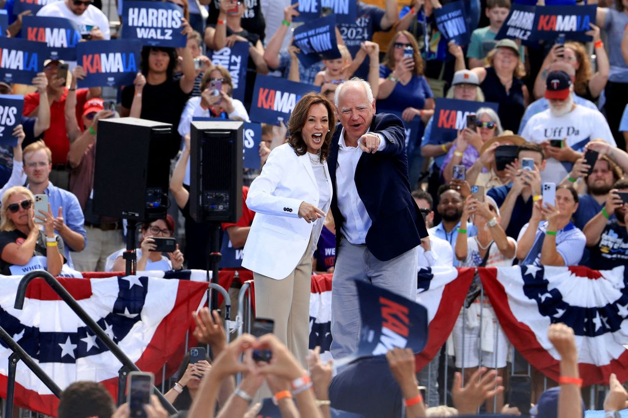 Vice President Kamala Harris and Gov. Tim Walz greet the crowd at a campaign event in Eau Claire, Wisconsin, on Wednesday.